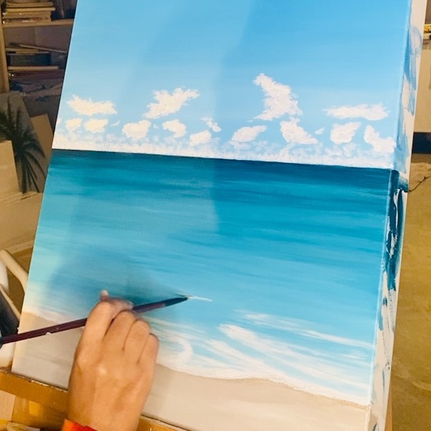 KY painting a bright ocean scene